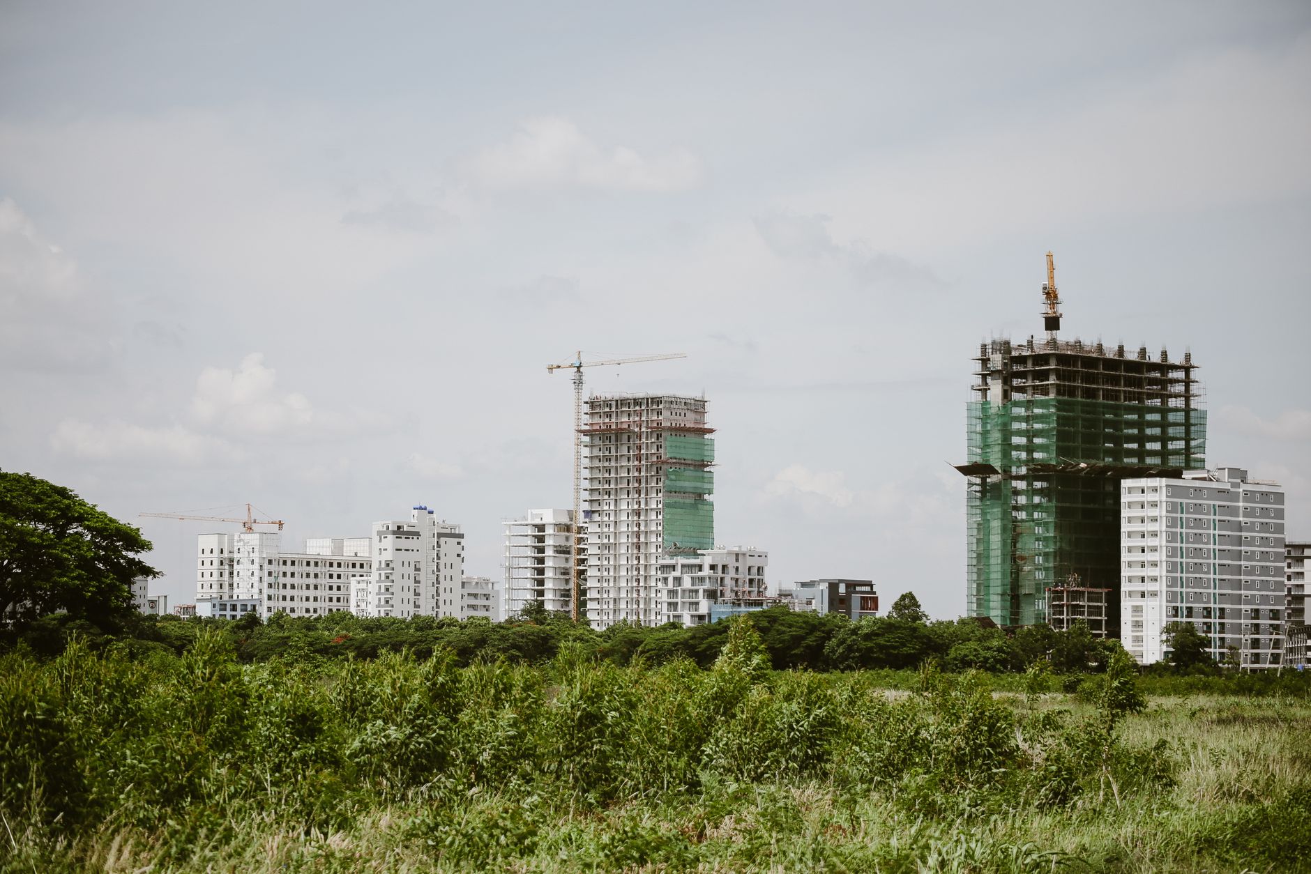 Construction site surrounded by modern buildings